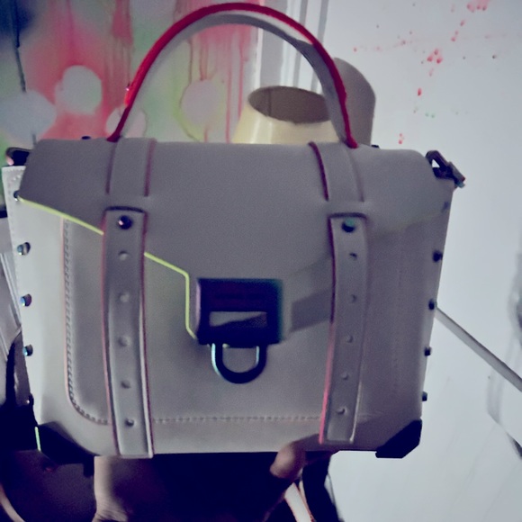 This is a Michael Kors Manhattan Medium Satchel. It has never been used. - Picture 3 of 3